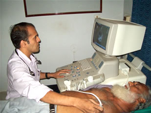 Dr Padmanabh Kamath doing an echo on a patient