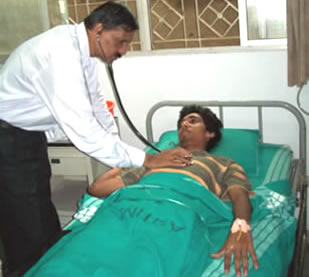 Dr Holla examining a patient
