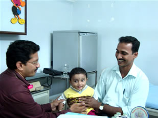 Dr Venguopal Rao with a little patient