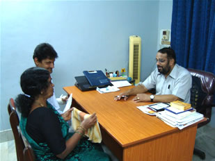Dr S.M. Bhat being consulted