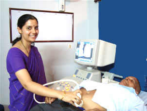 Dr Archana Adiga performing an ultrasound investigation